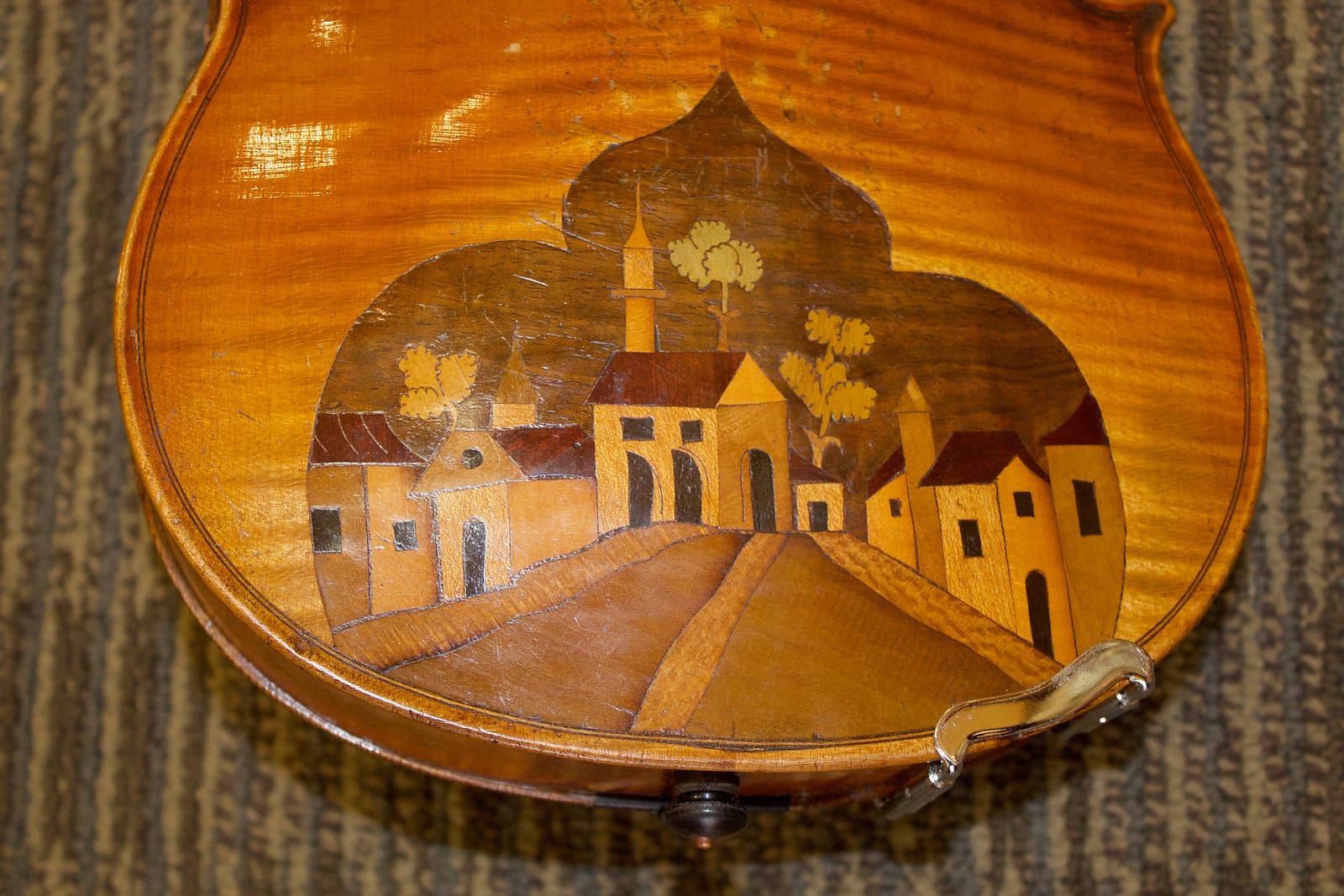 Village inlay on back closeup